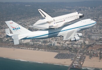 The space shuttle Endeavour atop the 747 shuttle carrier aircraft is seen flying over the Santa Monica Pier in Santa Monica during the final portion of its tour of California, Friday, Sept. 21, 2012. Photo Credit: (NASA/Jim Ross)